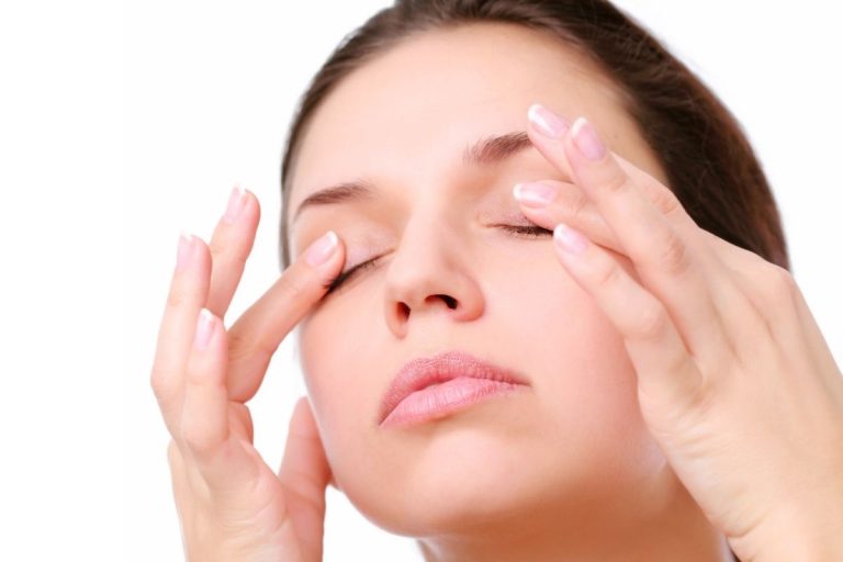 A person performing eye exercises with a backdrop of eye care illustrations.