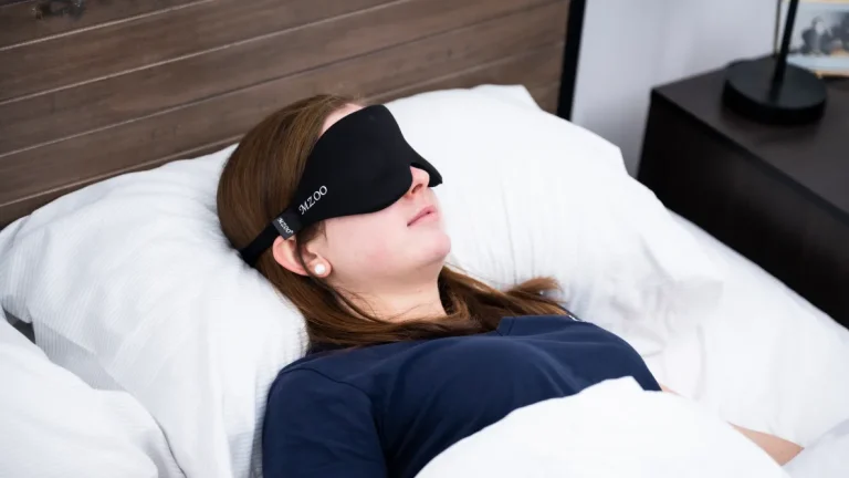 A person wearing a sleep mask after LASIK surgery with a note about its safe use.