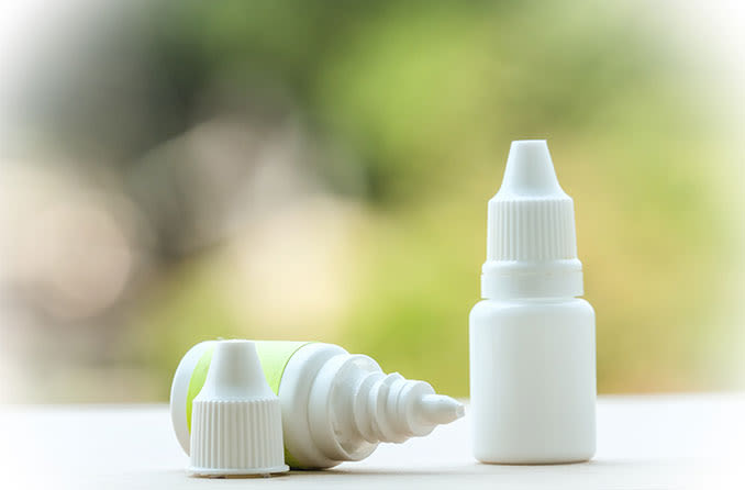 Bottles of various eye drops used for post-LASIK recovery.